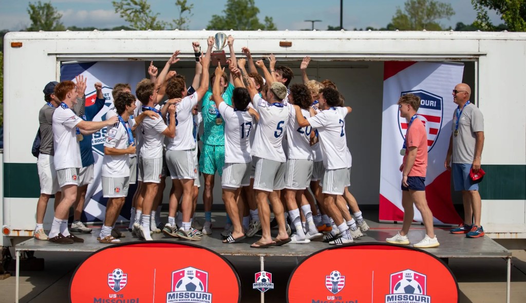 STLDA U19B Elite 64 celebrate after their State Cup win.